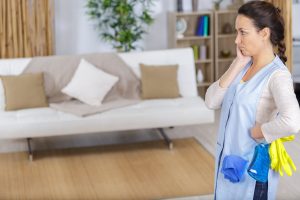 An upset woman wondering how to clean outdoor cushions in a washing machine